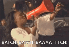 a woman is holding a megaphone in her mouth and screaming into it .