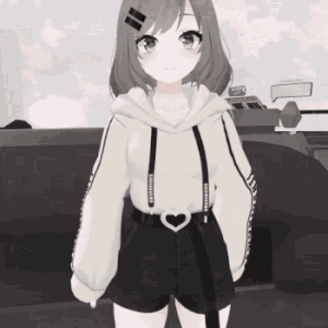 a girl wearing a white hoodie and black shorts