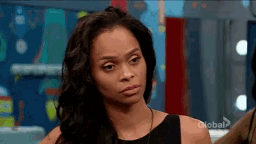 a woman with a serious look on her face is on a show called global