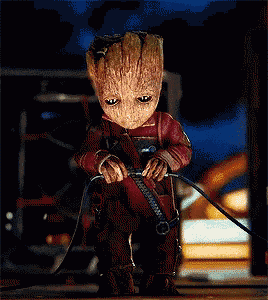 a baby groot from the movie guardians of the galaxy is sitting down