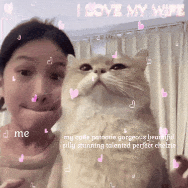 a woman holding a cat with the words " i love my wife " on the top
