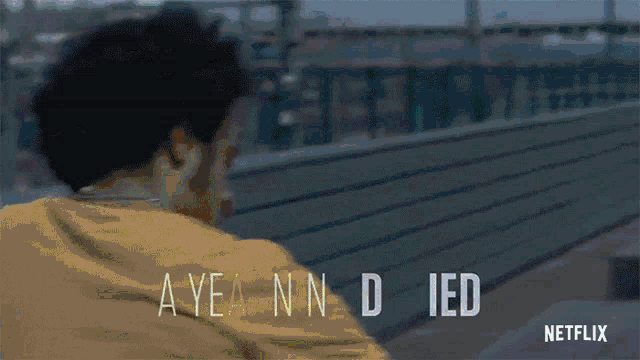a netflix ad with a man in a yellow shirt and the words ayea nn d ied