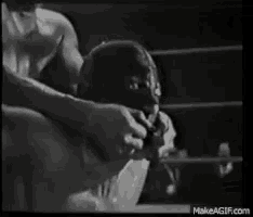 a black and white photo of two men in a boxing ring with makeagif.com at the bottom