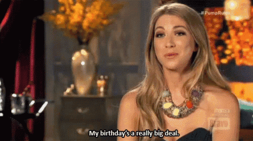 a woman is sitting in a room talking about her birthday and saying `` my birthday 's a really big deal . ''