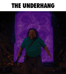 a man in a green shirt is standing in front of a purple portal with the words the underhang above him