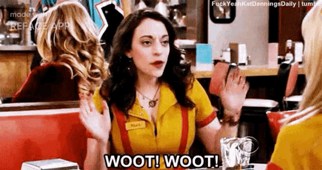 a woman is sitting at a table in a diner talking to another woman and saying wooti wooti .