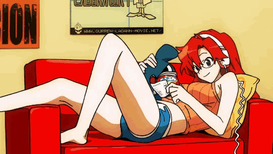 a girl is laying on a red couch in front of a sign that says ion on it