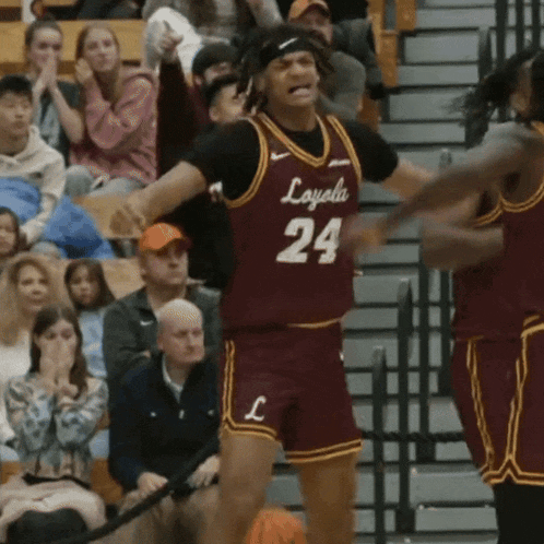 a basketball player wearing a maroon jersey with the number 24