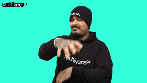 a man giving a thumbs up in front of a green background with the word multivers on it