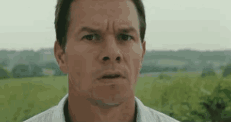 a close up of a man 's face with a serious look on his face .