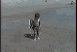 a person is riding a wave on a surfboard .