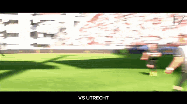 a blurry picture of a soccer field with the words vs utrecht on the bottom right