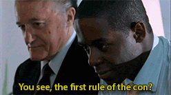 a man says " you see the first rule of the con " while another man looks on