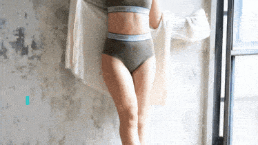 a woman is wearing a sweater and underwear that says calvin klein