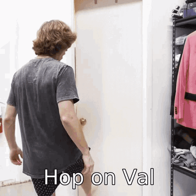 a man standing in front of a door with the caption hop on val