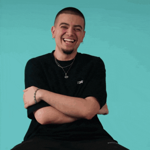 a man wearing a black shirt with the word coke on the front