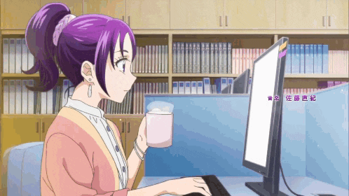 a woman with purple hair is typing on a computer while holding a cup