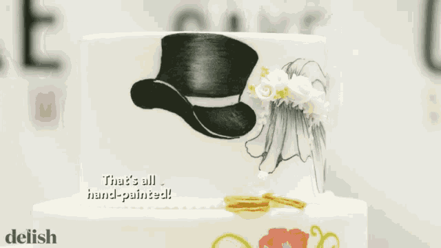 a wedding cake with the words that 's all hand painted at the bottom
