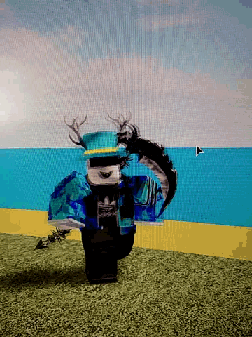 a computer screen shows a person wearing a blue outfit and a black hat