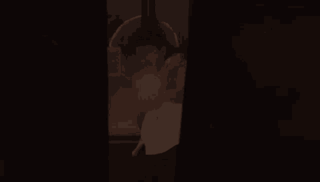 a man in a white shirt is being hit by a punch