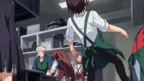 a man in a green apron is jumping in the air in a kitchen