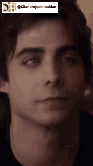 a close up of a young man 's face with a watermark that says t3fanprojecttoaidan