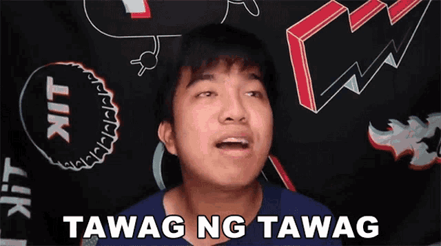 a young man says " tawag ng tawag " in front of a lik shirt