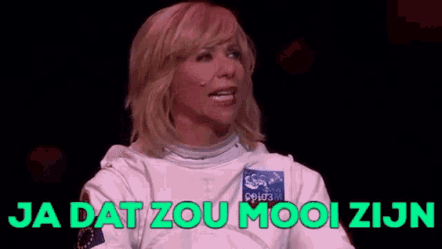 a woman in a space suit is standing on a stage and says ja dat zou mooi zijn .