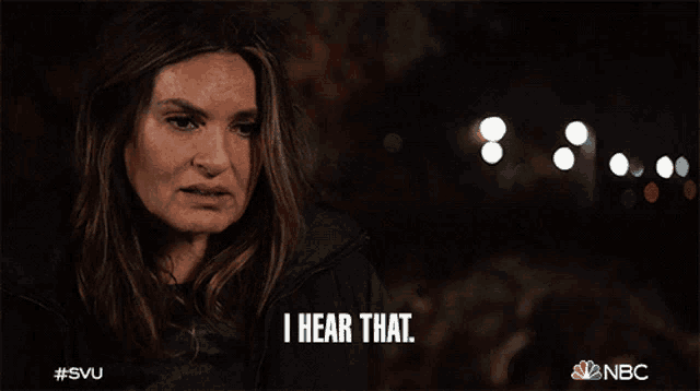 a woman says " i hear that " in front of a blurry background