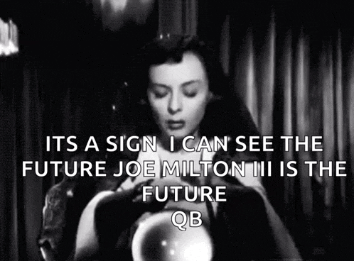 a black and white photo of a woman holding a crystal ball with the caption it 's a sign i can see