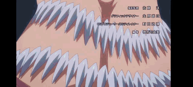 a close up of a person 's teeth with chinese writing underneath