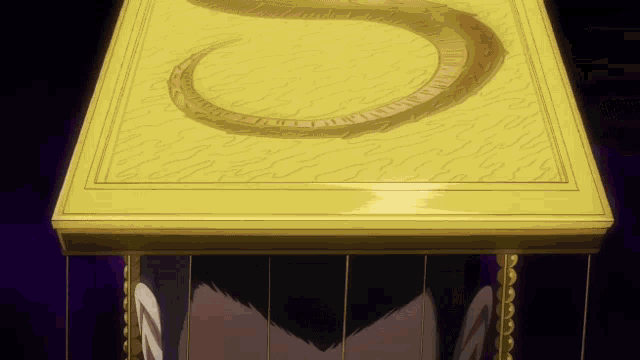 a yellow box with a snake on it and the letter s on it
