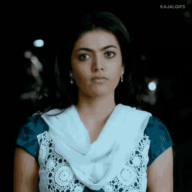 a close up of a woman 's face with the words kajalgifs written below it