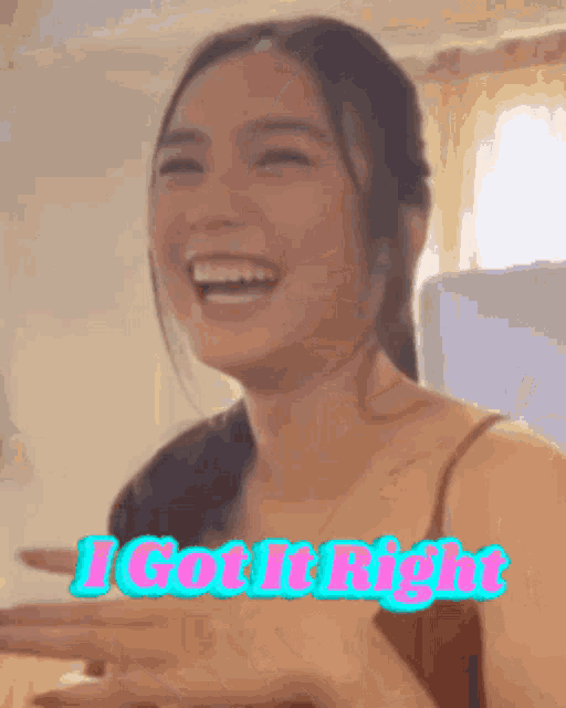 a woman is laughing with the words " i got it right " behind her