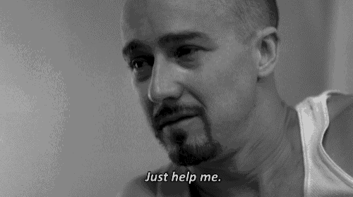 a black and white photo of a man with a beard saying just help me .