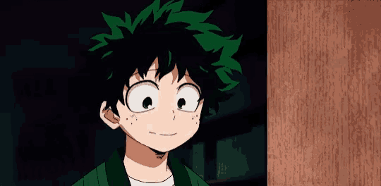a boy with green hair is smiling in front of a sign that says almost