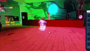 a screenshot of a video game shows a person dancing on a stage with a green background