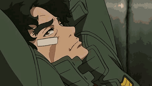 a man with a bandage on his face laying down