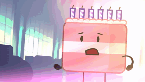 a pink cake with candles on top of it