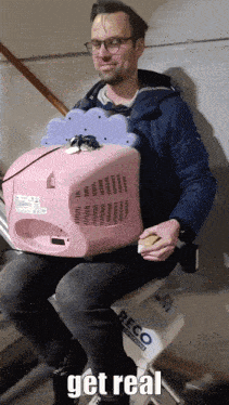 a man is sitting on a recco chair holding a pink container