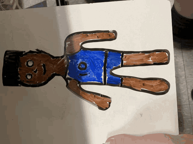 a child 's drawing of a person with the number 10 on their shorts