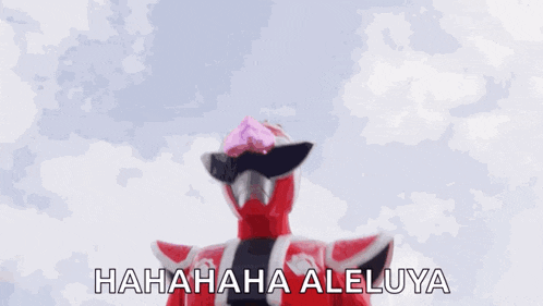 a red superhero is holding a fan in his hand and laughing .
