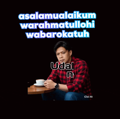 a man in a plaid shirt sits at a table