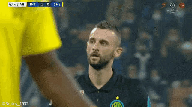 a soccer player in a black shirt with the letter o on it