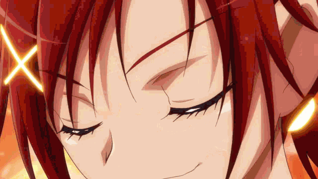 a close up of a girl 's face with red hair and an x on her head