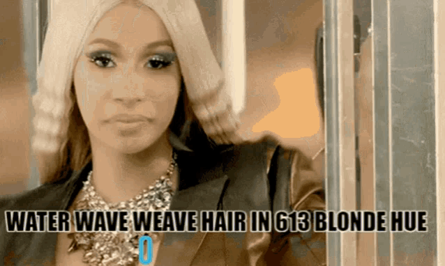 a woman with blonde hair and the words water wave weave hair in 613 blonde hue on the bottom