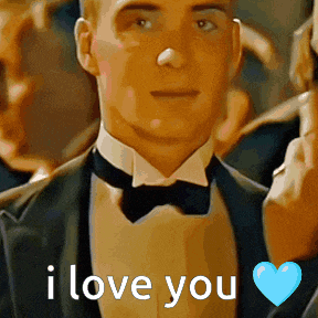 a man in a tuxedo says i love you with a heart