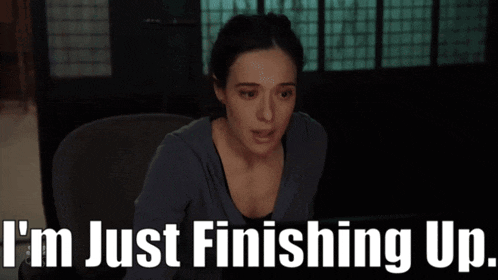 a woman sits in a chair with the words i 'm just finishing up