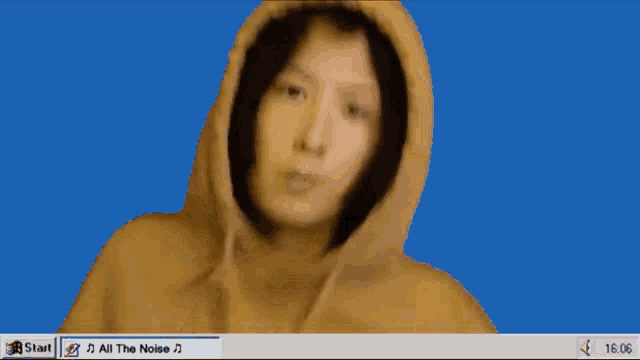 a woman wearing a hoodie is playing all the noise on a computer screen
