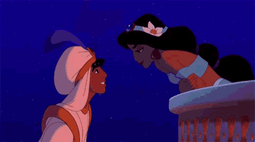 a man and a woman are kissing with a flower in their hair